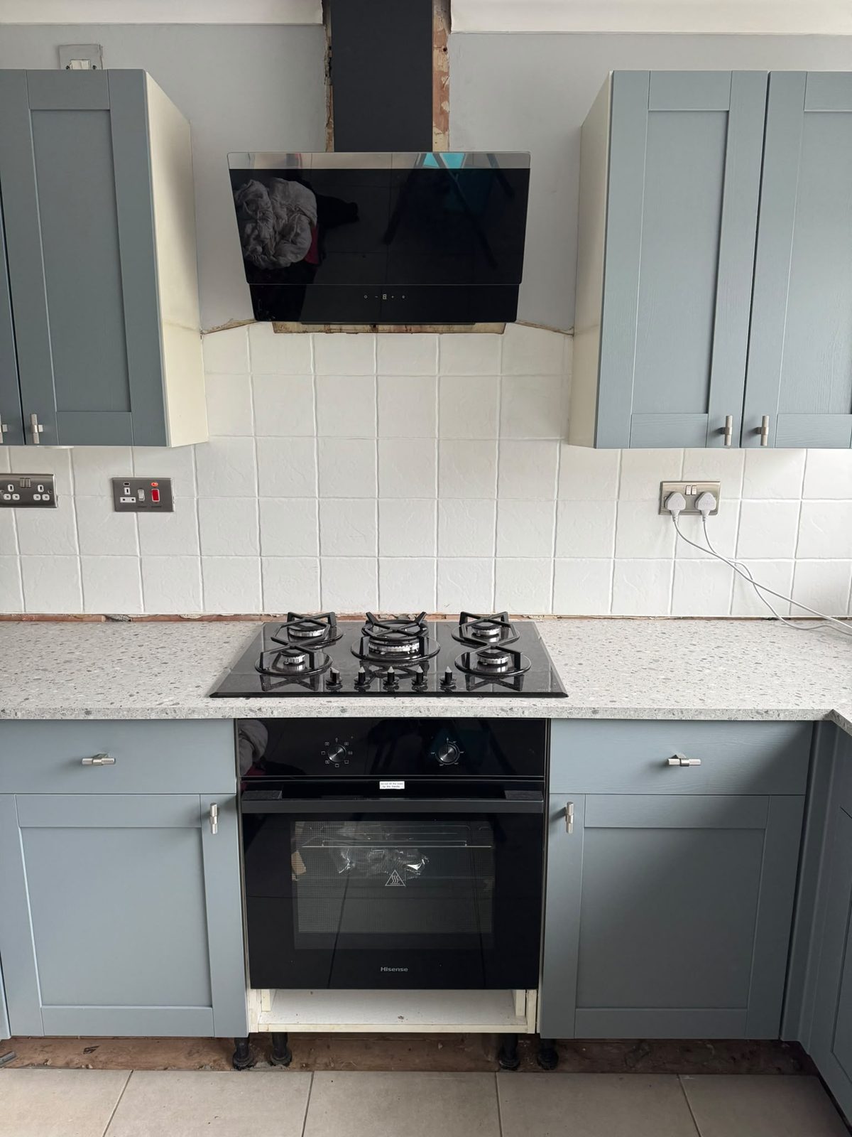 Angled cooker hood installed and wired in above the hob